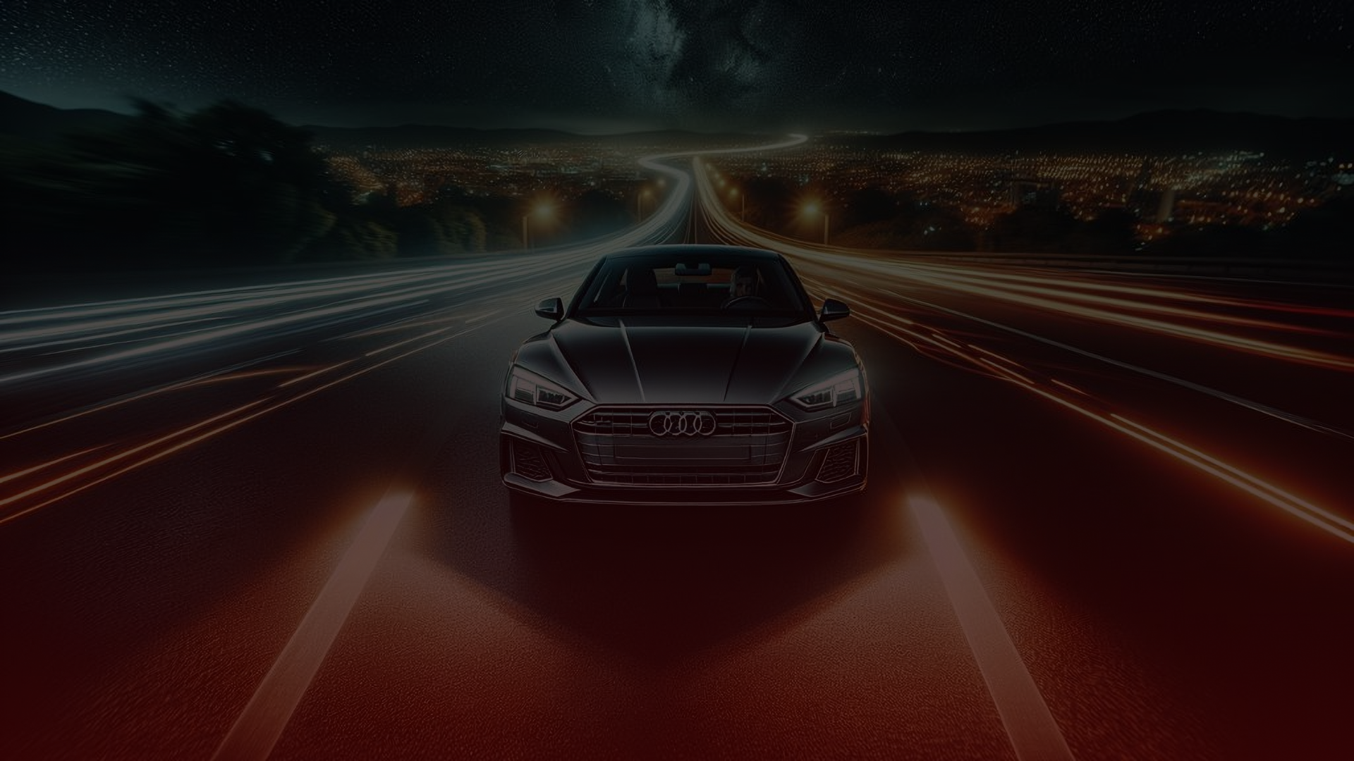 A sleek black car glides along the highway at night, its headlights and taillights leaving dynamic light trails. Under the starry sky and city lights, it exudes performance that highlights an Audi mechanic Scarborough would surely admire. EuroMechanic | Redline Automotive | Top Reviewed Auto Repair Shop in Scarborough | Visit redlineautomotive.ca